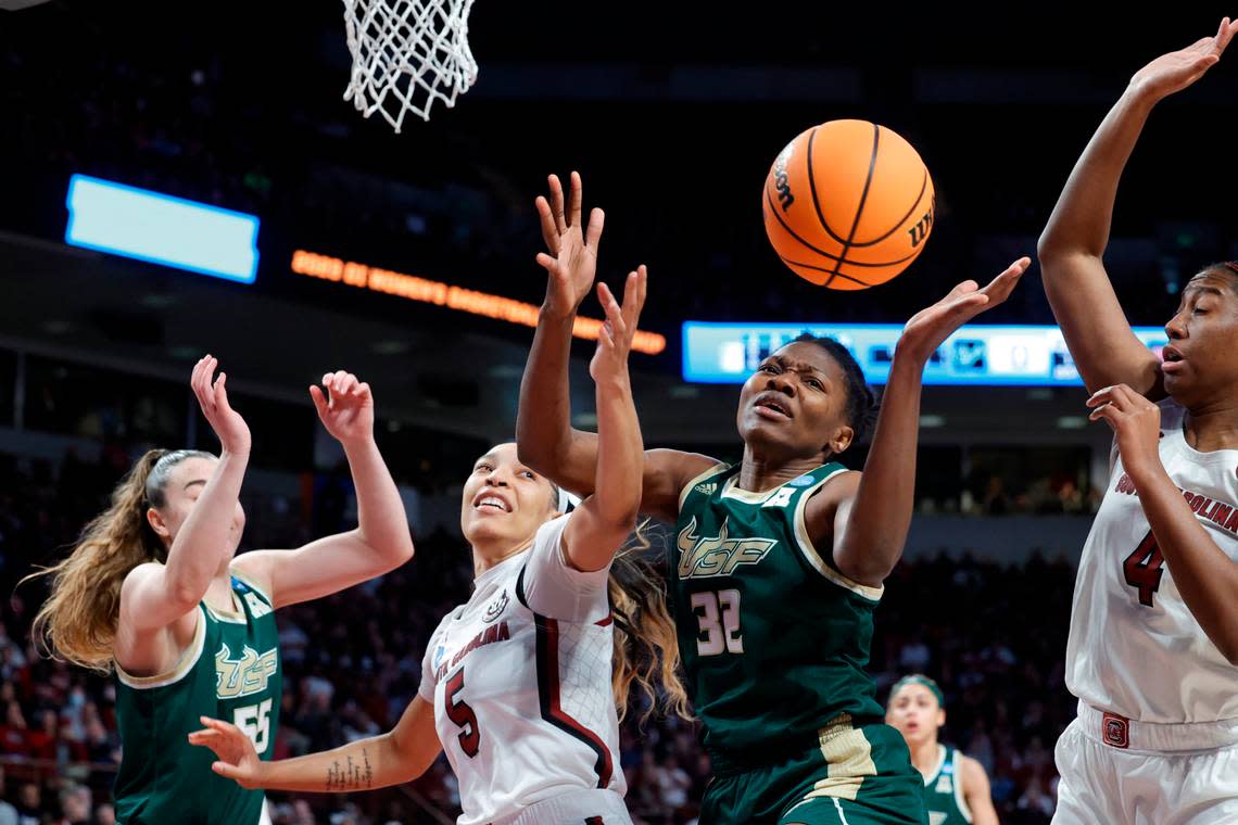 South Carolina’s Victaria Saxton (5) fights to recover the ball in Sunday’s game against South Florida in the NCAA Tournament at Colonial Life Arena on Sunday, March 19, 2023.