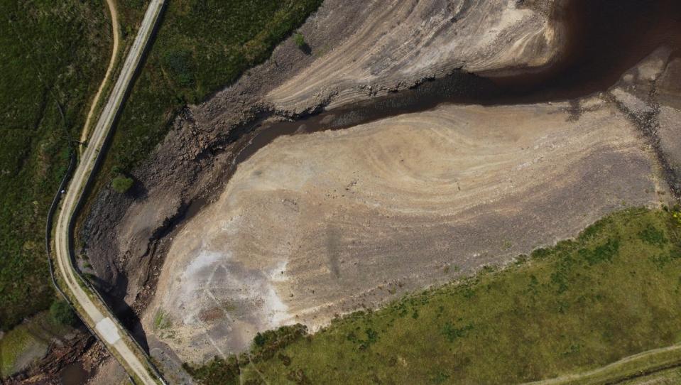 A dry bank of a tributary to the Dowry reservoir during the continuing hot weather, near Oldham in July (Reuters)