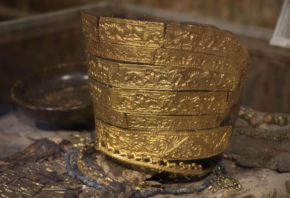 A fourth century B.C. golden ceremonial headgear, an ancient treasure from a Scythian king's burial mound, is exhibited in the Museum of Historical Treasures in Kyiv, Ukraine, Friday, Sept. 2, 2022. Fearing Russian troops would storm the city, museum employees dismantled exhibits, carefully packing away artifacts into boxes for evacuation. For now, the museum is just showing copies. (AP Photo/Efrem Lukatsky)