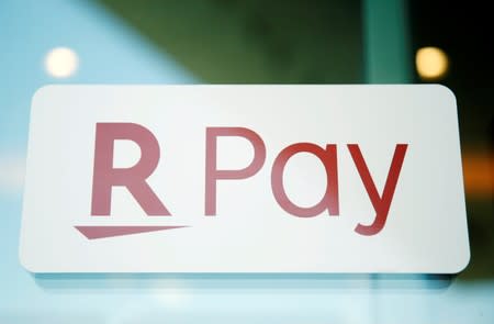 The logo of Rakuten Pay, QR code mobile payment system operated by Rakuten, is displayed at a coffee shop in Tokyo