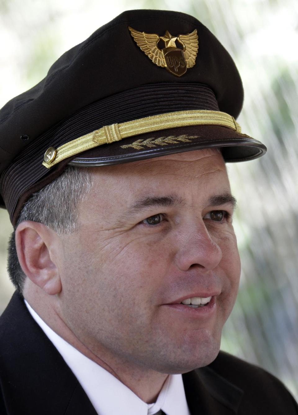 Capt. Jon Burrows speaks about the long flight for Kali, an orphaned polar bear cub from Alaska, during a news conference at the Buffalo Zoo in Buffalo, N.Y., Wednesday, May 15, 2013. Luna, a resident polar bear cub at the zoo, will be the playmate for Kali until a permanent home is located. (AP Photo/David Duprey)