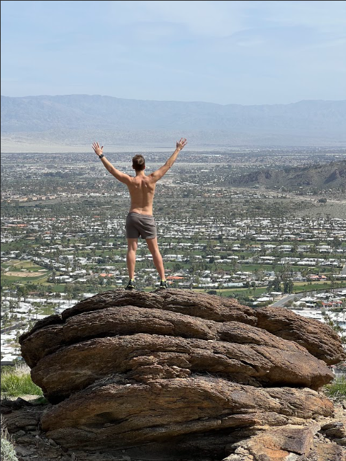 A hiker poses on the South Lykken trail.