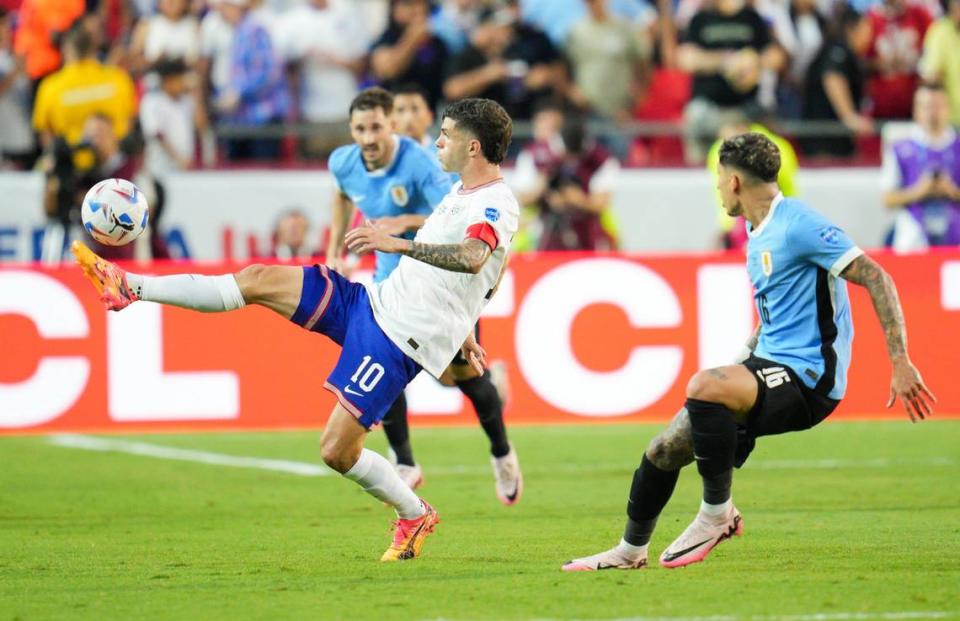 United States forward Christian Pulisic (10) controls the ball against Uruguay defender Mathias Olivera (16) during the first half of a Copa America match at Arrowhead Stadium in Kansas City, Missouri, on July 1, 2024. (Jay Biggerstaff/USA TODAY Sports)