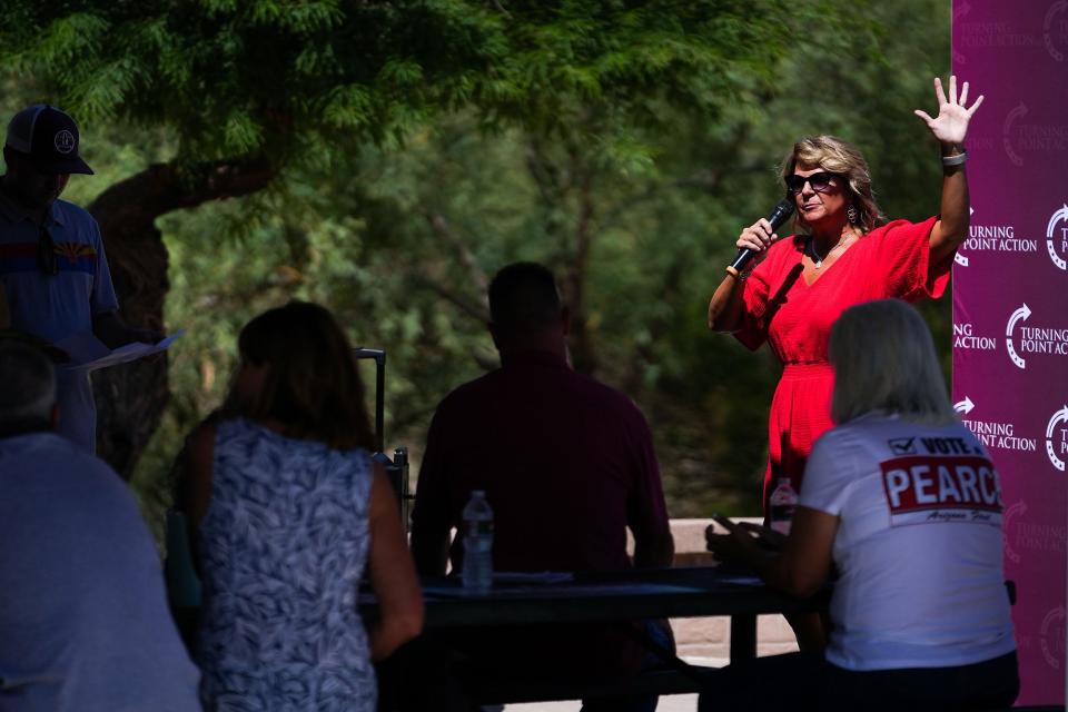 Kelli Ward, head of the Arizona Republican Party, speaks to attendees during a get out the vote rally event put on my Turning Point Action on Saturday, July 30, 2022, in Mesa.