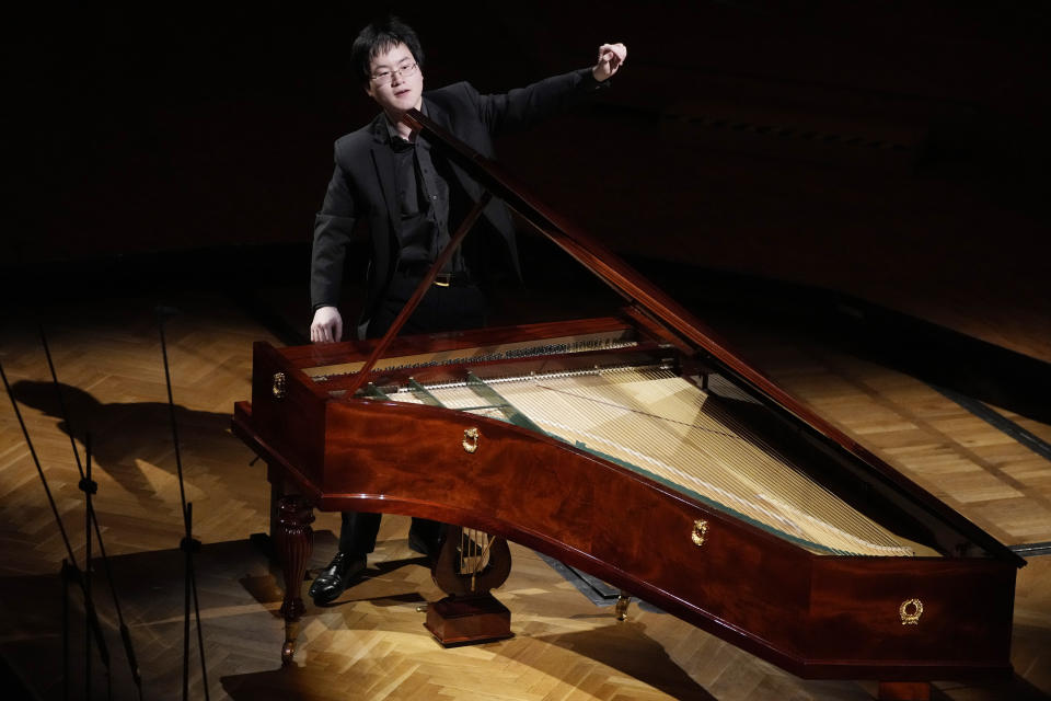 Canadian pianist Eric Guo plays Frederic Chopin's Concerto in F minor on a replica of a 1830 Pleyel piano during a concert marking the 19th century piano virutoso and composer's 214th birthday, in Warsaw, Poland, on Friday, March 1, 2024. Guo won a quintannual competition to play Chopin on period instruments organized by the Fryderyk Chopin Institute. (AP Photo/Czarek Sokolowski)