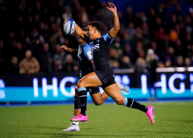 Ben Thomas celebrates scoring a try