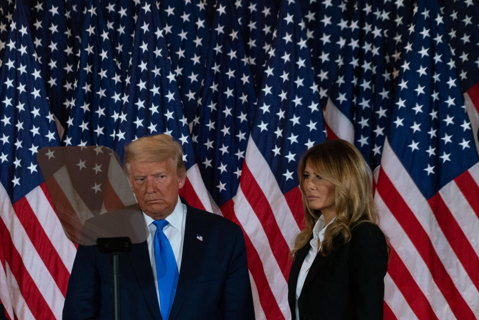 <strong>Washington, D.C., Nov. 4, 2020.</strong> "Around three in the morning, the press pool was finally called to the East Room for a statement. A crowd of 100 or so loyalists eagerly awaited the President's speech. The feeling of the crowd was muted. Though Trump was ahead in the vote, journalists were beginning to predict that Biden would be victorious once the absentee and mail-in ballots were counted. Trump eventually came out to cheers and delivered a speech alleging shadowy voter fraud and claiming victory. The normally controlled façade of his boilerplate expressions dropped for a moment, revealing a very worried man. As I headed to the hotel after filing my pictures, someone dressed in a clown suit was performing an interpretive dance and taping anti-Trump signs to the asphalt outside the White House."<span class="copyright">Peter van Agtmael—Magnum Photos for TIME</span>