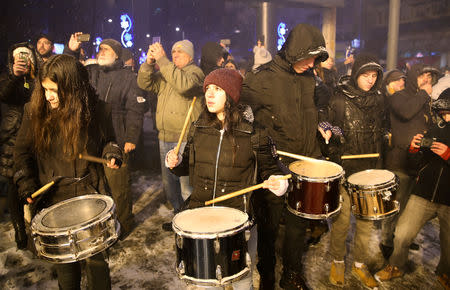 People people play drums as they demonstrate in front of the Radio Television of Serbia headquarters during an anti-government protest in Belgrade, Serbia, January 5, 2019. REUTERS/Marko Djurica