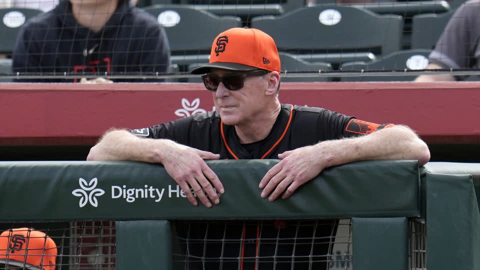 Melvin watches his players during the first inning of a Spring Training game. - Ross D. Franklin/AP