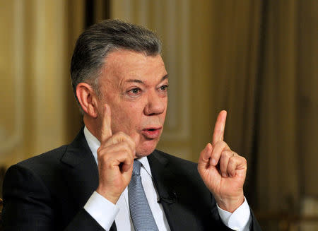 Colombia's outgoing President Juan Manuel Santos speaks with Reuters at the presidential palace, in Bogota, Colombia July 30, 2018. Picture taken July 30, 2018. REUTERS/Carlos Julio Martinez