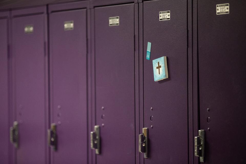 A cross hangs on a student's locker as classes resume in Dawson Springs, Kentucky for the first time since December's tornado. Jan. 18, 2022