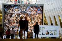 <p>“The Last Judgement” stands above “Up Close: Michelangelo’s Sistine Chapel” re-creation exhibit at the Oculus at Westfield World Trade Center in New York. The exhibit features 34 reproductions, including “The Creation of Adam.” (AP Photo/Michael Noble Jr.) </p>