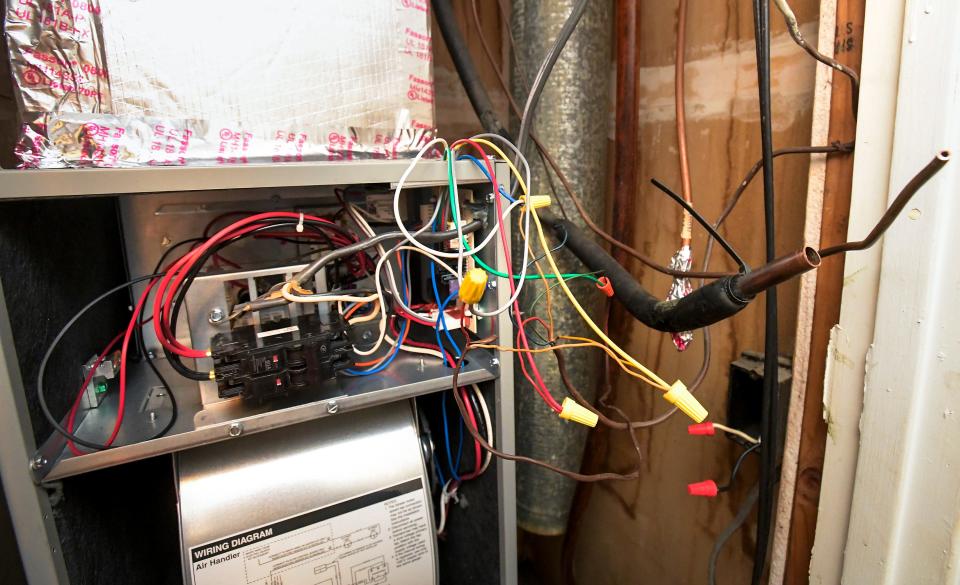 Bernetta Harris’ apartment at Brentwood Estates has exposed wiring and a breaker box that constantly switches off.