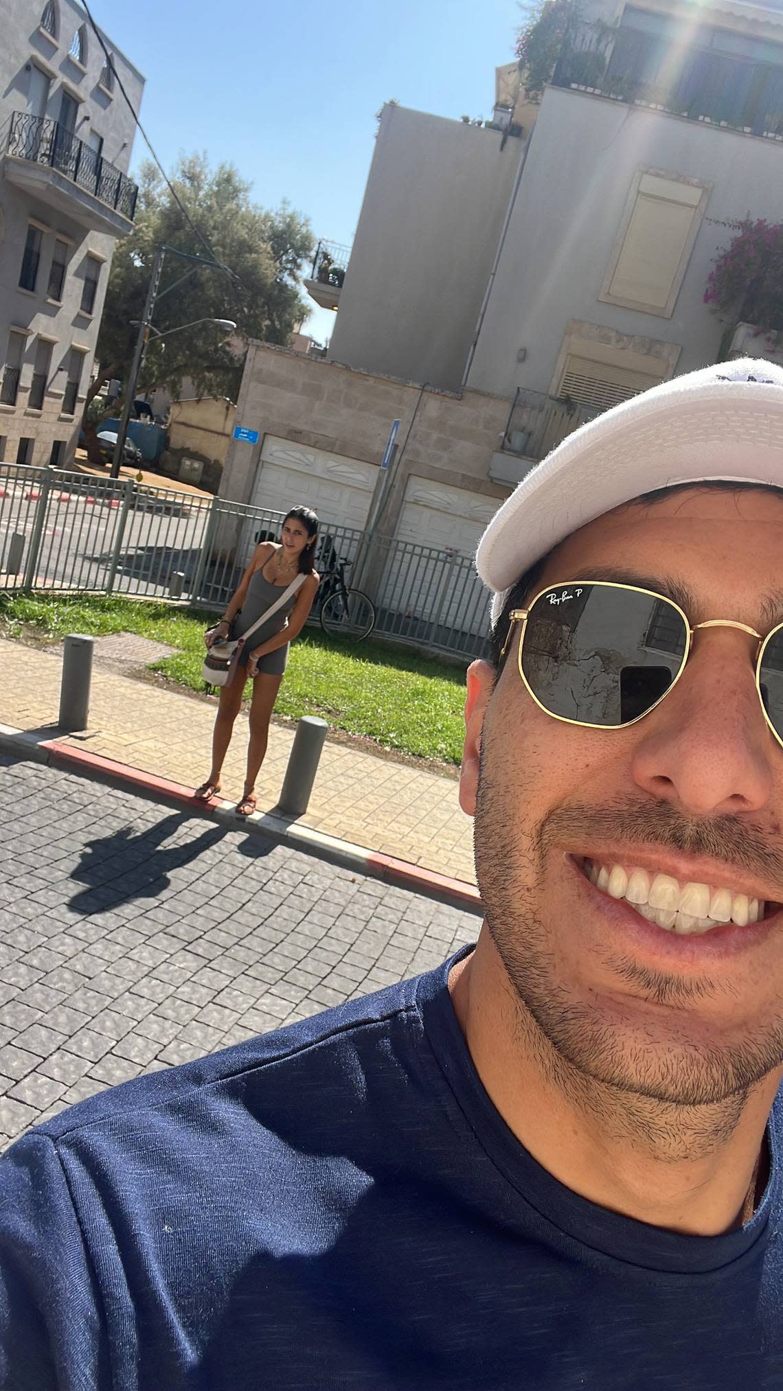 Guy Gil, a 29-year-old real estate developer from Sunny Isles Beach, was visiting his family in Tel Aviv at the time of the Hamas attacks. The woman behind him is his 22-year-old cousin, who was attending the Supernova Music Festival near the Gaza Strip on Saturday, Oct. 7, 2023, where Hamas militants killed more than 260 Israelis and took people hostage. She was injured and hospitalized. The photo was taken about 10 hours before the festival.