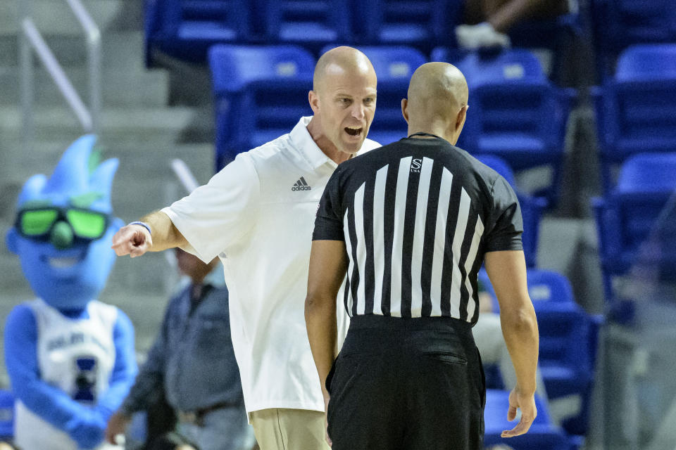 Texas A&M Corpus Christi head coach Steve Lutz argues a call against Northwestern State during the first half an NCAA college basketball game in the finals of the Southland Conference men's tournament in Lake Charles, La., Wednesday, March 8, 2023. (AP Photo/Matthew Hinton)