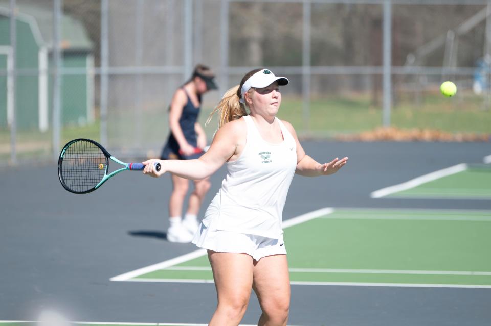 Pennfield senior Vivian Burns winds up to hit the ball during a match against Hastings at Pennfield High School on Monday, April 15, 2024.