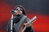 DAYTONA BEACH, FL - FEBRUARY 26: Lenny Kravitz performs during driver introductions prior to the start of the NASCAR Sprint Cup Series Daytona 500 at Daytona International Speedway on February 26, 2012 in Daytona Beach, Florida. (Photo by Streeter Lecka/Getty Images)