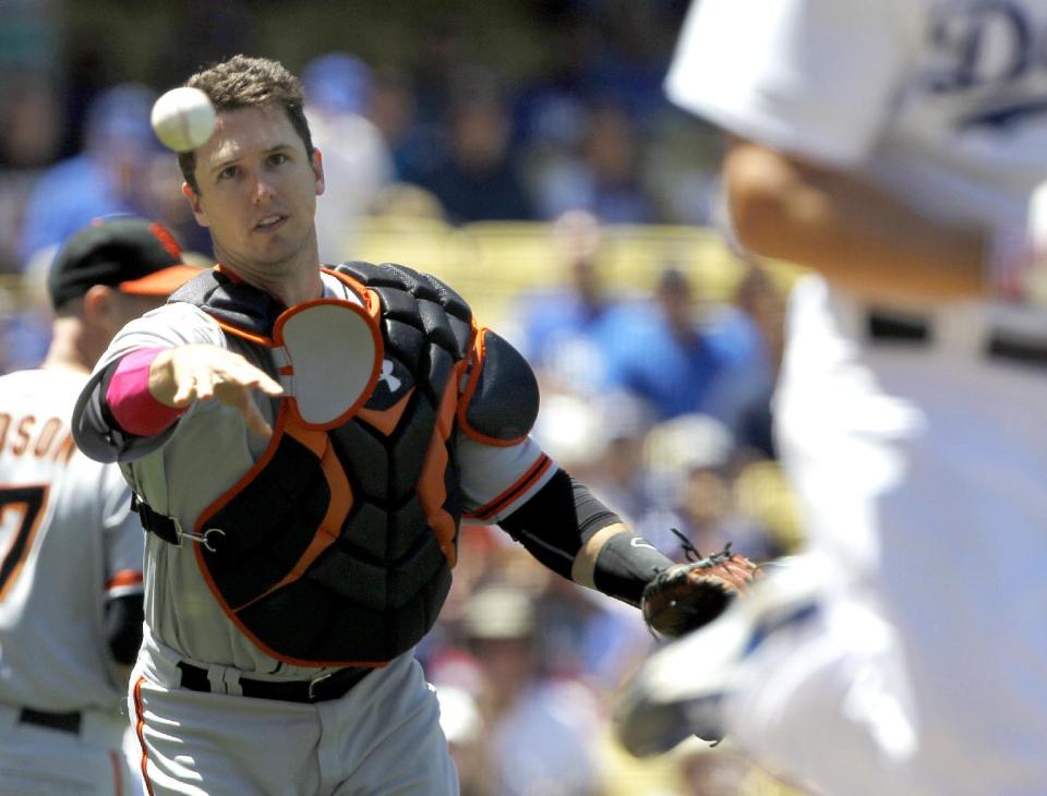 San Francisco Giants catcher Buster Posey throws out Los Angeles Dodgers' Clayton Kershaw on a sacrifice bunt in the third inning of a baseball game on Sunday, May 11, 2014, in Los Angeles. (AP Photo/Alex Gallardo)