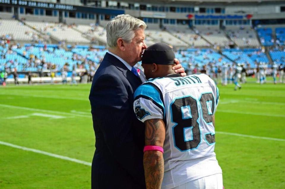 In 2011, then-Panthers owner Jerry Richardson embraced Steve Smith before a game.