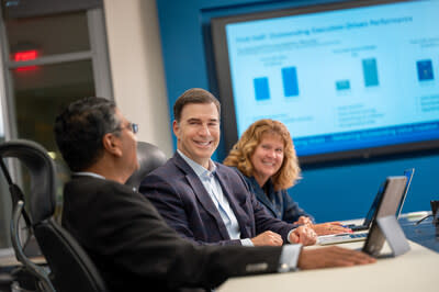 Wesco CEO John Engel (center) with other executives at Pittsburgh, PA headquarters. Images created by Elliott Cramer