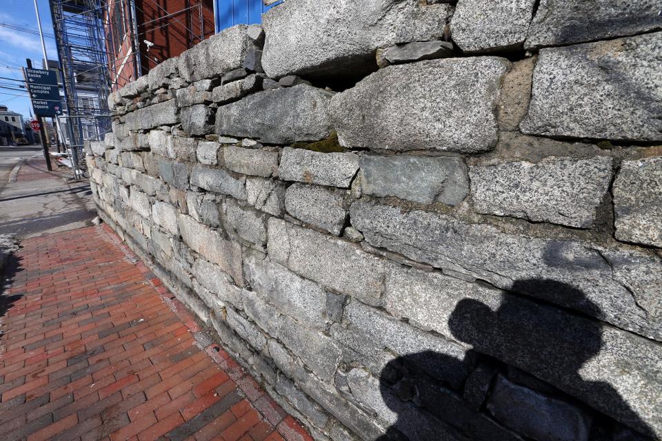 Portsmouth's Historic District Commission voted to allow developer Mark McNabb to dismantle a 300-year-old stone wall and reconstruct it after he completes the redevelopment of the Treadwell-Jenness mansion.