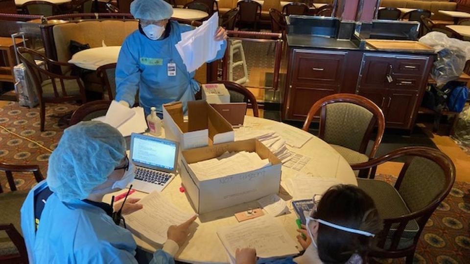 Pharmacists aboard the Diamond Princess cruise ship work to fill prescriptions for passengers during the 14-day quarantine in Yokohama, Japan.