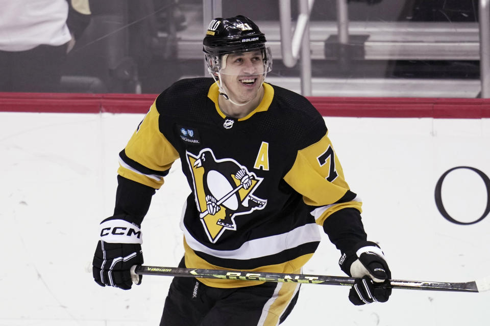 Pittsburgh Penguins' Evgeni Malkin looks at a replay of his goal during the first period of the team's NHL hockey game against the Montreal Canadiens in Pittsburgh, Tuesday, March 14, 2023. (AP Photo/Gene J. Puskar)