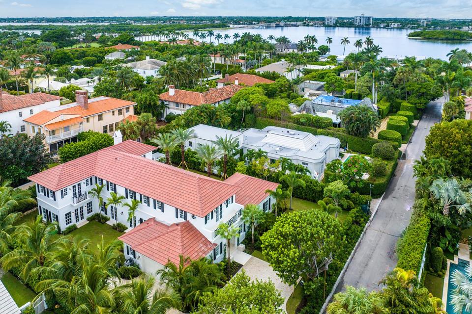 A new Palm Beach house at 130 Algoma Road, foreground, is the fifth home from the Intracoastal Waterway. The house stands on the third street north of The Mar-a-Lago Club. Agents Dana Koch and Paulette Koch of the Corcoran Group have the estate priced at $17.5 million.