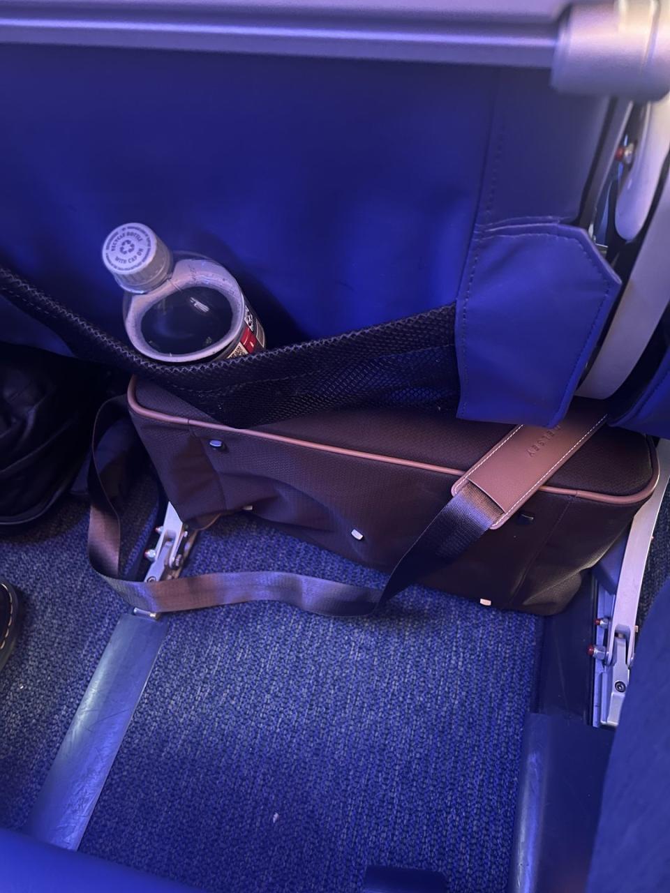 a bag under an airplane seat