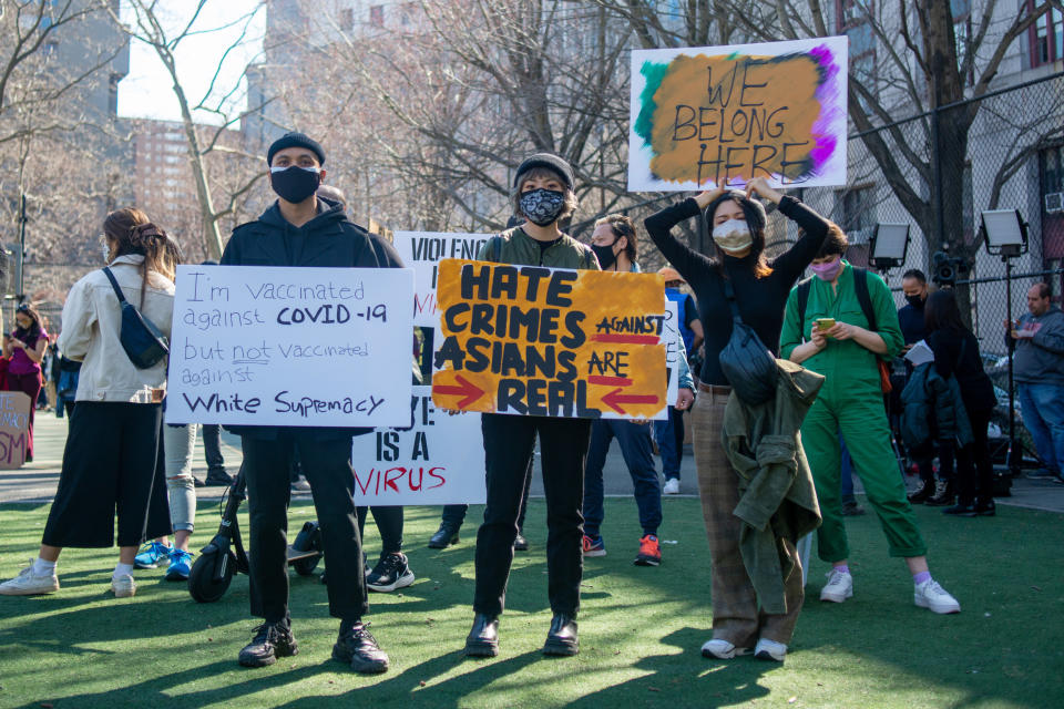 Asian Americans gather to protest at the "Rally Against Hate" in Chinatown