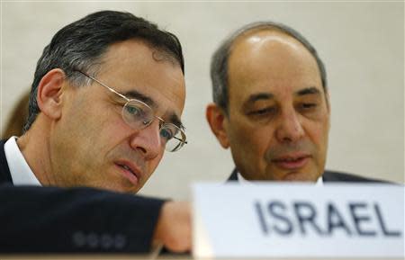 Shai Nitzan (L) Deputy Attorney General Ministry of Justice of Israel waits with Eviatar Manor, Israel Ambassador to the U.N. before the Human Rights Council Universal Periodic Review session on Israel at the European headquarters of the United Nations in Geneva October 29, 2013. REUTERS/Denis Balibouse