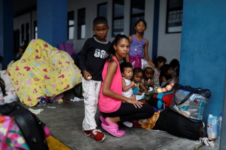 The Wider Image: Venezuelan mothers, children in tow, rush to migrate