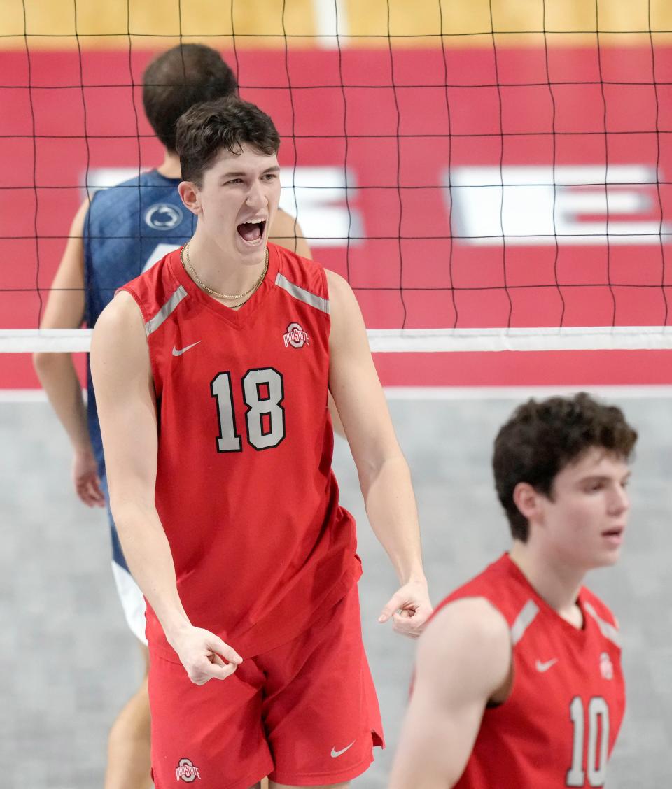 Ohio State middle blocker Cole Young (18) celebrates a point during a match against Penn State at the Covelli Center.