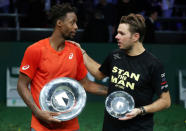 Tennis - ATP 500 - Rotterdam Open - Rotterdam Ahoy, Rotterdam, Netherlands - February 17, 2019 France's Gael Monfils celebrates winning the Rotterdam Open with the trophy alongside runner-up Switzerland's Stan Wawrinka REUTERS/Yves Herman