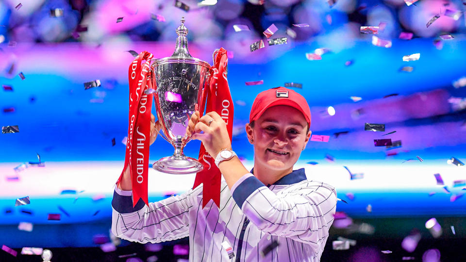 Ash Barty celebrates winning the WTA Finals title.