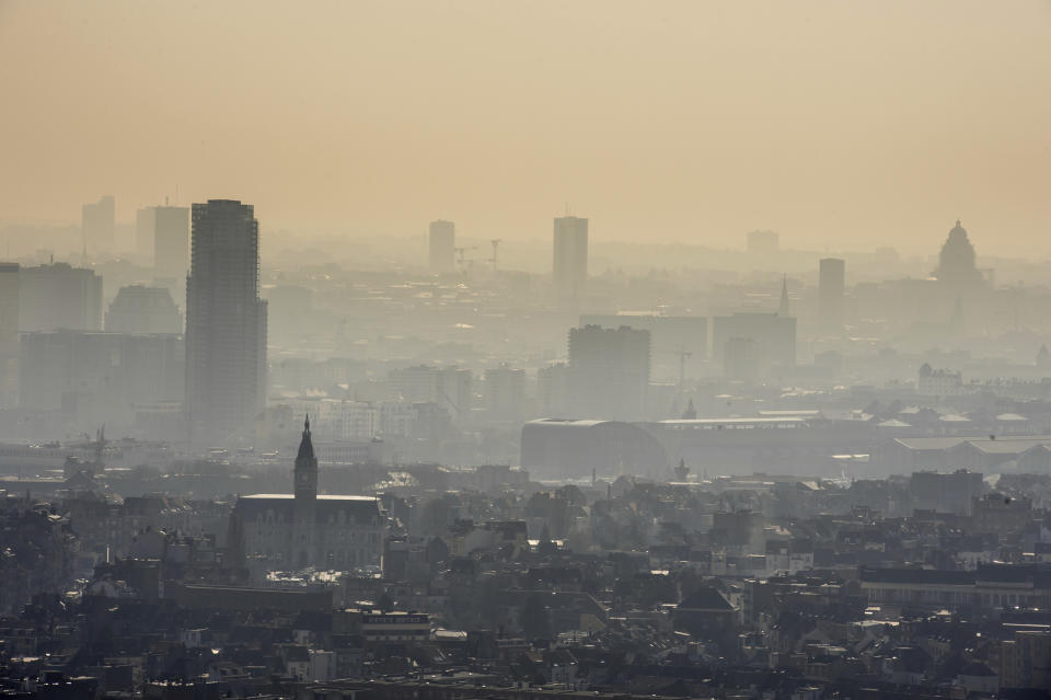 FILE - In this March 14, 2014 file photo a layer of smog covers the city of Brussels. The European Union says it will miss its targets for reducing planet-warming greenhouse gases by 2030 unless member states make a greater effort than they have so far. (AP Photo/Geert Vanden Wijngaert, file)