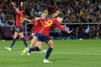 <p>Spain's Olga Carmona celebrates after a low shot across goal to give them the lead in the final. Photo: AP Photo/Alessandra Tarantino</p> 