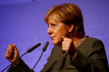 German Chancellor Angela Merkel, a top candidate of the Christian Democratic Union Party (CDU) for the upcoming general elections, gestures as she speaks during an election rally in Hamburg, Germany, September 20, 2017. REUTERS/Morris Mac Matzen ?