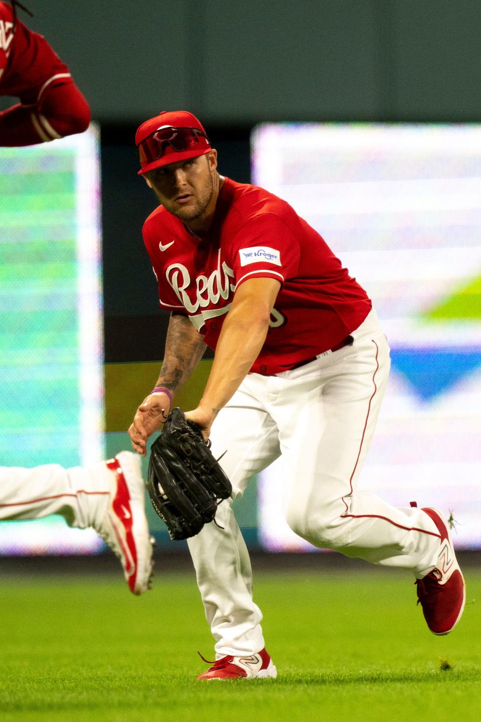 Cincinnati Reds third baseman Nick Senzel (15) fields an RBI base hit by Pittsburgh Pirates catcher Endy Rodriguez (25) in the fourth inning of the MLB baseball game between the Cincinnati Reds and the Pittsburgh Pirates at Great American Ball Park in Cincinnati on Saturday, Sept. 23, 2023.