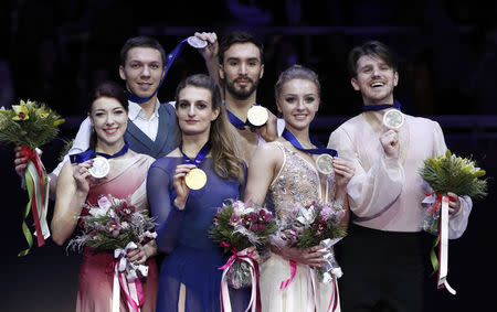 Figure Skating - ISU European Championships 2018 - Ice Dance Victory Ceremony - Moscow, Russia - January 20, 2018 - Gold medallists Gabriella Papadakis and Guillaume Cizeron of France (C), silver medallists Ekaterina Bobrova and Dmitri Soloviev of Russia (L) and bronze medallists Alexandra Stepanova and Ivan Bukin of Russia attend the ceremony. REUTERS/Grigory Dukor