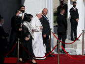 Pope Francis, center, walks with Iraqi President Barham Salih towards his plane upon concluding his visit to Iraq at Baghdad airport, Iraq, Monday, March 8, 2021. Pope Francis left Baghdad on Monday after three days of the historic whirlwind tour of Iraq that sought to bring hope to the country's marginalized Christian minority with a message of coexistence, forgiveness and peace. (AP Photo/Khalid Mohammed)