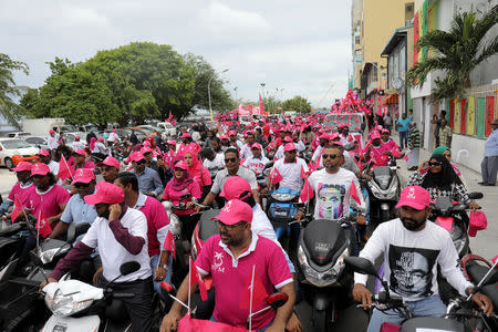 Supporters of the Maldivian President Abdulla Yameen ride on their bikes during the final campaign march rally ahead of the presidential election in Male, Maldives September 22, 2018. REUTERS/Stringer