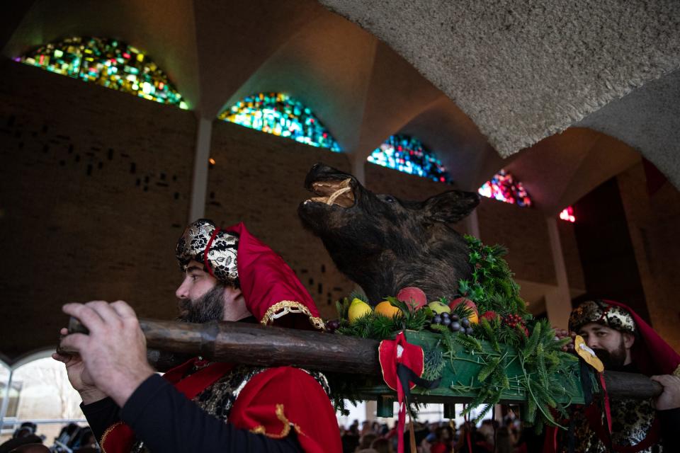 A boar's head is carried in a procession at the First Christian Church's Boar's Head and Yule Log Festival on Saturday, Jan. 7, 2023, in Corpus Christi, Texas.