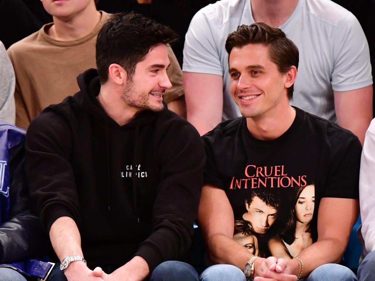 Kevin Harrington and Antoni Porowski at a basketball game