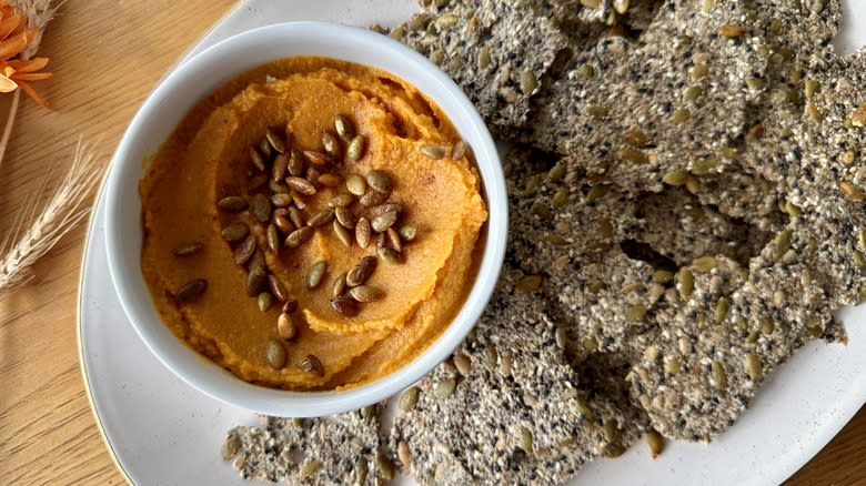 Pumpkin seed crackers and hummus 