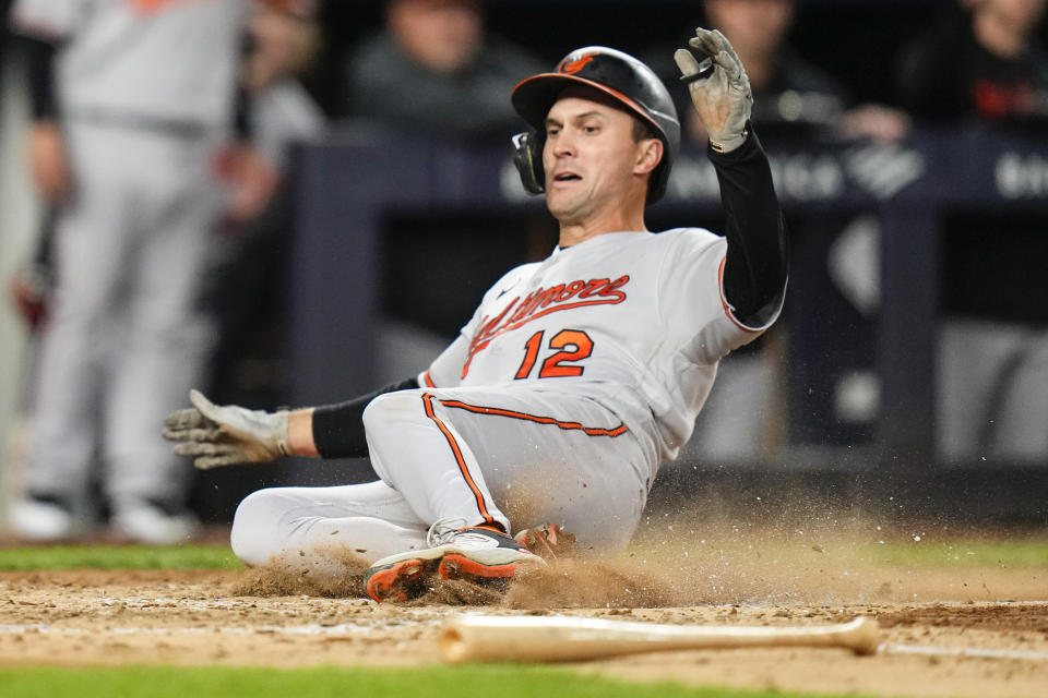 Baltimore Orioles' Adam Frazier slides home to score on a single by Anthony Santander during the fifth inning of the team's baseball game against the New York Yankees on Thursday, May 25, 2023, in New York. (AP Photo/Frank Franklin II)