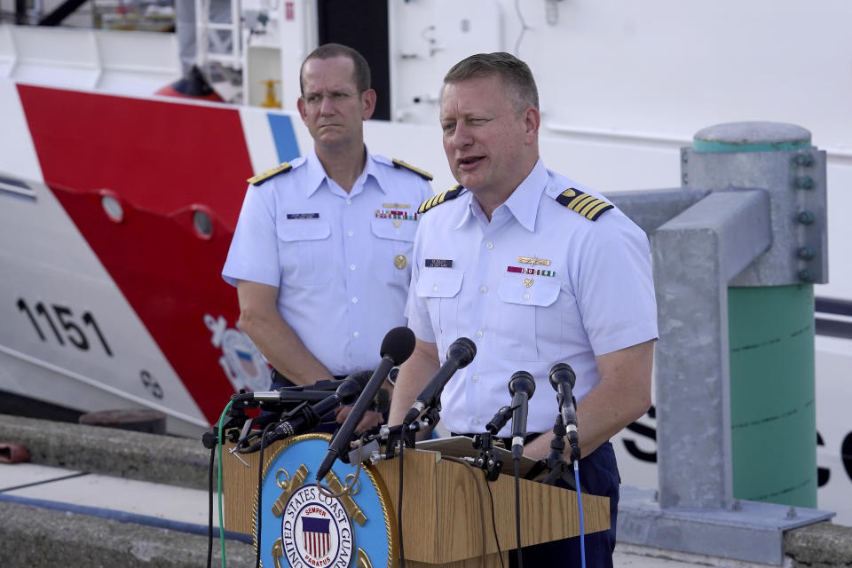 Capt. Jason Neubauer, chief investigator, U.S. Coast, right, speaks with the media as U.S. Coast Guard Rear Adm. John Mauger, commander of the First Coast Guard District, left, looks on during a news conference, Sunday, June 25, 2023, at Coast Guard Base Boston, in Boston. The U.S. Coast Guard said it is leading an investigation into the loss of the Titan submersible that was carrying five people to the Titanic, to determine what caused it to implode. (AP Photo/Steven Senne)