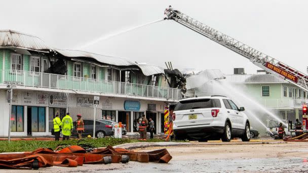 PHOTO: Key West Fire Department works on a strip mall fire on Flagler Ave., in midtown Key West, Fla., in the aftermath of Hurricane Ian's tropical winds, Sept. 28, 2022. (Mary Martin/AP)