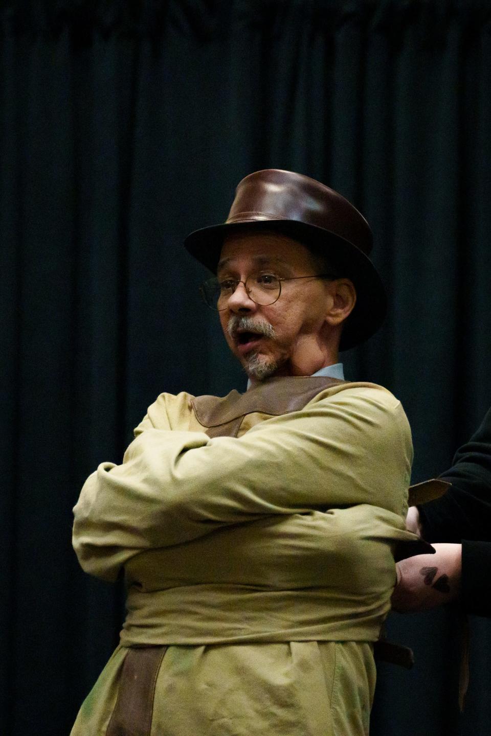 Dr. Tom Virden has an audience member secure his straight jacket before performing an escape at a conference on ASU's West campus on Nov. 18, 2022, in Glendale. Virden is a professor at Midwestern University and uses performance to enhance his teaching.