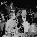 <p>Famed director and master of suspense, Alfred Hitchcock, attends the 8th Annual Primetime Emmy Awards with his wife, Alma.</p>